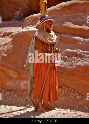 A man dressed in historical costume entertains tourists at Petra, Jordan - one of the new seven wonders of the world Stock Photo