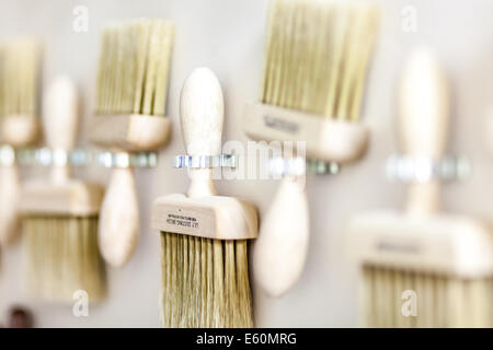 decorators paint brushes on a wall Stock Photo