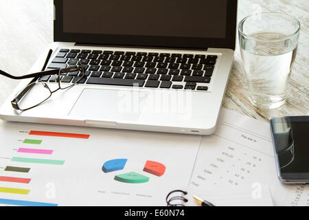 Working, analyzing graphics and doing calculations Stock Photo
