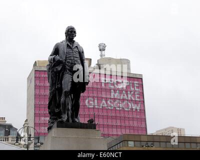 Rabbie Burns statue with the 'People make Glasgow' slogan in George Square, Glasgow City Centre, Scotland