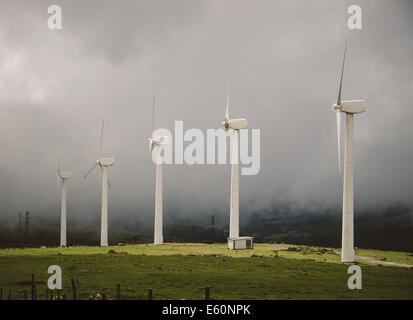 Windmills in the Mist in Galicia, Spain. Stock Photo