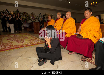 Tibetan monks, family members, mourners, Vietnamese funeral, memorial service, Little Saigon, city of Westminster, California Stock Photo