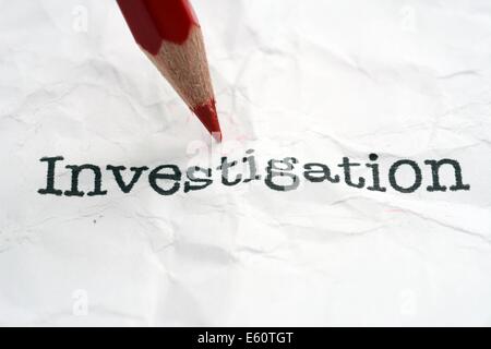 Investigation text on paper Stock Photo
