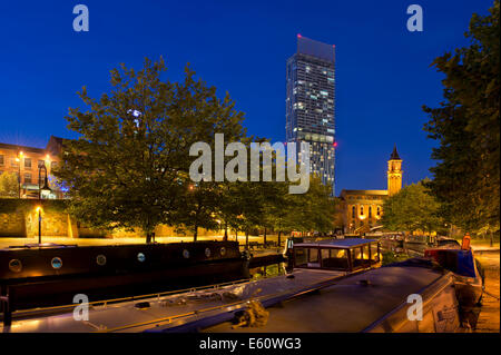 The Castlefield Urban Heritage Park and historic inner city canal conservation area with Beetham Tower in Manchester at night. Stock Photo