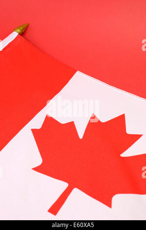 Background close up of Canadian Maple Leaf red and white  flag for national public holiday event. Stock Photo