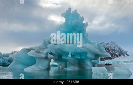Iceberg tourists in a rubber dinghy, at Monacobreen Glacier, Liefdefjorden, Spitsbergen, Svalbard Islands Stock Photo