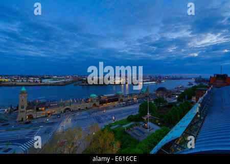 Elbe River with the St Pauli Landing Stages and the Blohm and Voss shipyard at dusk, Hamburg, Germany Stock Photo