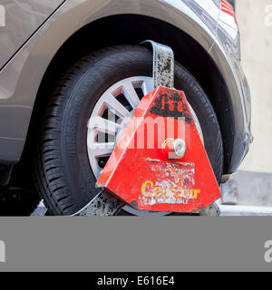 Wheel clamp on a vehicle, Budapest, Hungary Stock Photo