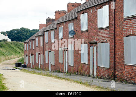 Boarded up empty Victorian terraced houses near Doncaster, UK. Housing stock can be refurbished so they are fit to live in. Stock Photo