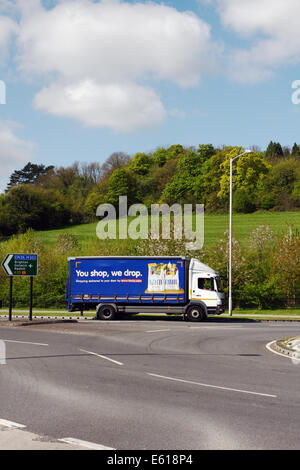 A Tesco truck entering a roundabout in Coulsdon, Surrey, England Stock Photo