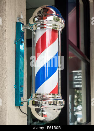 Vintage barber shop sign with rotating stripes Stock Photo