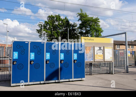 Bike Locker Users Club BLUC secure lockers for cycle storage outside Old Trafford Metrolink tram station. Manchester England UK Stock Photo