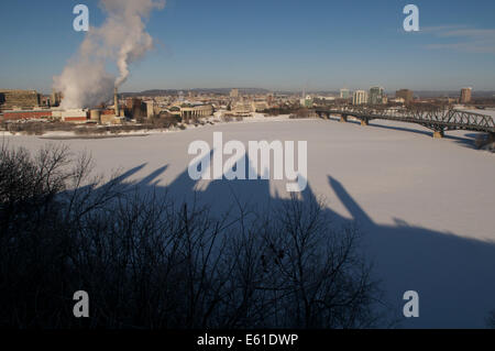 Shadows of Canada's House of Parliament are cast on the frozen Ottawa river in this view across to the river to Quebec.