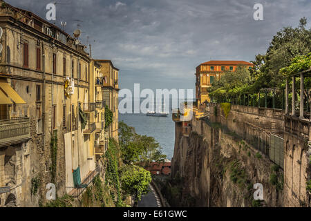 Italian shipping route - A ship sails past the Italian town of Sorrento, shot taken from the point of view from the cliffs Stock Photo