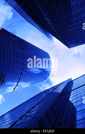 Modern skyscrapers close-up toned in blue color Stock Photo - Alamy