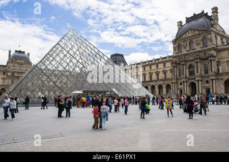 Tourists and visitors outside Louvre Museum in Paris, France Stock Photo