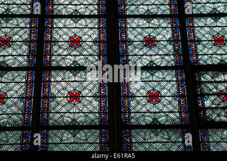 Stained glass window inside the Notre Dame Cathedral in Paris, France Stock Photo