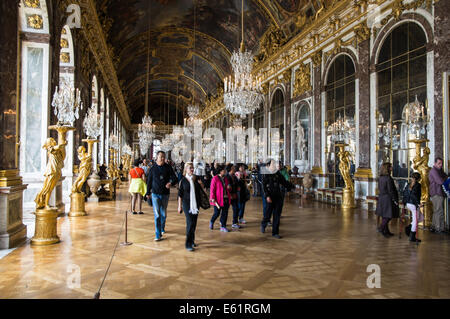 Tourists in the Hall of Mirrors of the Palace of Versailles, Chateau de Versailles, in France Stock Photo