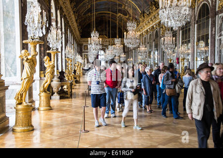 Tourists in the Hall of Mirrors of the Palace of Versailles, Chateau de Versailles, in France Stock Photo