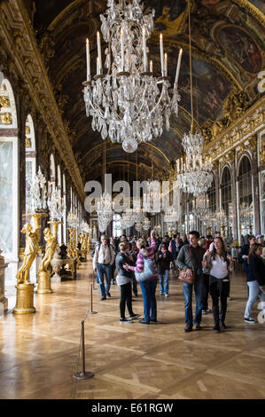 Tourists in the Hall of Mirrors of the Palace of Versailles, Chateau de Versailles, in France Stock Photo