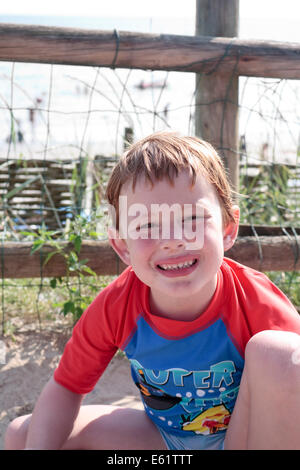 A five-year old caucasian boy smiling on holiday Stock Photo