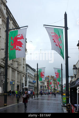 Welsh Flags flying in St Mary Street, Cardiff, South Wales, UK Stock Photo