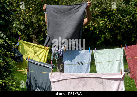 Woman laundry hanging on clothesline Czech Stock Photo