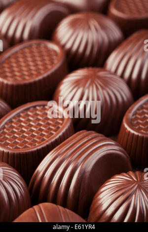 Assorted delicious chocolate candies background Stock Photo