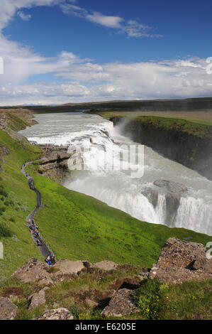 Tourists enjoying a panoramic view of Gullfoss waterfall on the Hvita River in southwest Iceland Stock Photo