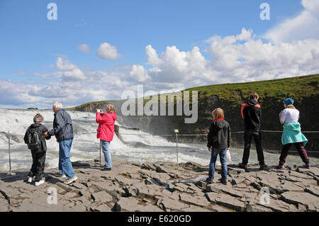 Tourists enjoying a panoramic view of Gullfoss waterfall on the Hvita River in southwest Iceland Stock Photo
