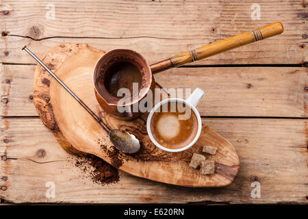 Coffee in coffee pot on wooden background Stock Photo