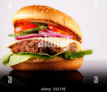 Fresh hamburger with many vegetables on black reflex background Stock Photo