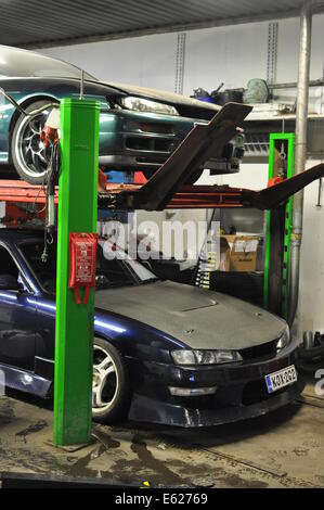 Two Nissan 200sx s14 koukis in the garage Stock Photo