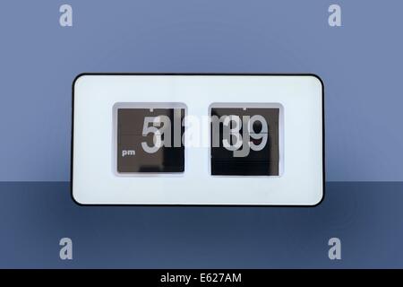 A close up shot of a flip clock Stock Photo