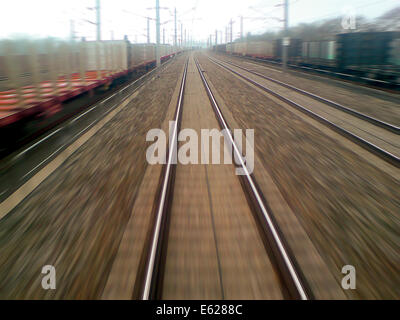 Railroad tracks from the perspective of the engine driver in the fast moving train. Stock Photo