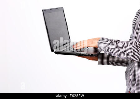Side view portrait of a man using laptop Stock Photo