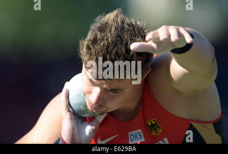 Zurich, Switzerland. 12th Aug, 2014. David Storl of Germany competes in the men's Shot Put Qualifying at the European Athletics Championships 2014 at the Letzigrund stadium in Zurich, Switzerland, 12 August 2014. Photo: BERND THISSEN/dpa/Alamy Live News Stock Photo