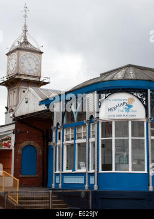 Cleethorpes Railway Station Clock Tower behind Mermaid restaurant, Cleethorpes, Lincolnshire, England, UK. Stock Photo