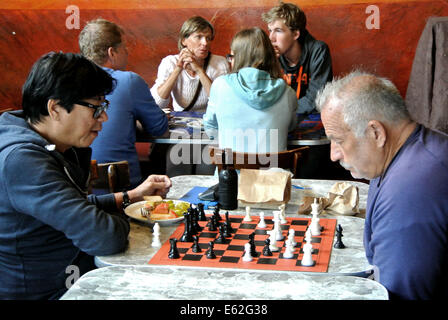 two men play chess in the Cafe Trieste coffee shop and restaurant in North Beach San Francisco Stock Photo