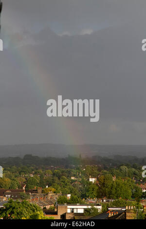 Wimbledon, London, UK. 12th Aug, 2014. Weather: A rainbow appears after a  storm in wimbledon south west London Credit:  amer ghazzal/Alamy Live News Stock Photo