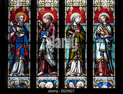 The four Evangelists stained glass in the East Window, Holy Trinity Church, Bosbury, Herefordshire, England, UK Stock Photo