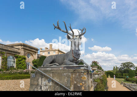 Statue of a stag in the gardens of Bowood House, a Georgian stately home near Calne, Wiltshire, UK, on a sunny day with blue sky Stock Photo