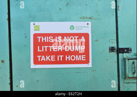 Litter sign on a door take litter home Stock Photo