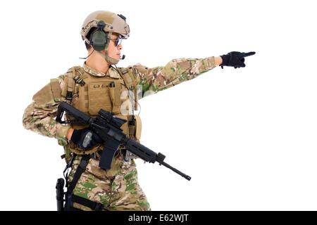 Soldier holding rifle or sniper and directing Stock Photo