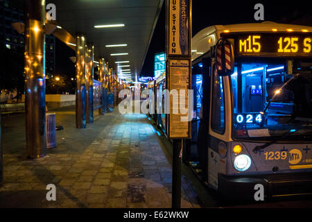 Manhattan, New York. An empty bus at a station near the Staten Island Ferry terminal at night. Stock Photo
