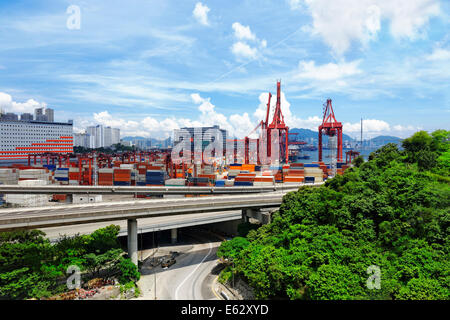 Port warehouse with containers and industrial cargoes at day Stock Photo