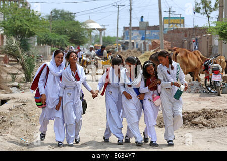 Young students pupils in school uniforms on their way home from school, christian village of Khushpur, Punjab Province, Pakistan Stock Photo