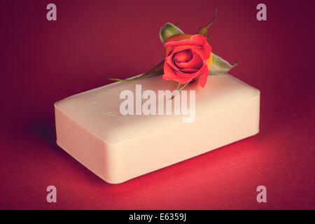Pink soap with rose flower on pink background Stock Photo