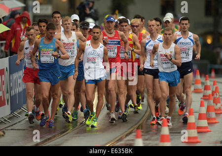 Zurich, Switzerland. 13th Aug, 2014. Athlets competes in the men's 20km walking race at the European Athletics Championships 2014 in Zurich, Switzerland, 13 August 2014. Photo: Bernd Thissen/dpa/Alamy Live News Stock Photo