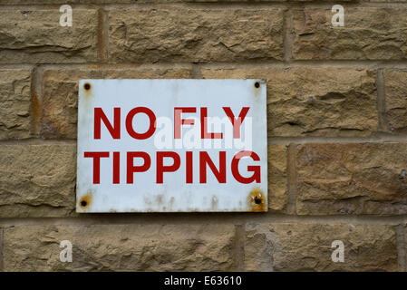 No Fly Tipping sign on wall Stock Photo